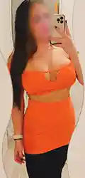 Mirror selfie in bright orange outfit